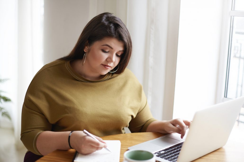 Woman working on laptop.