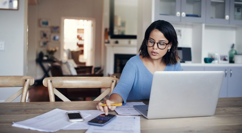 Woman analyzing spending reports.