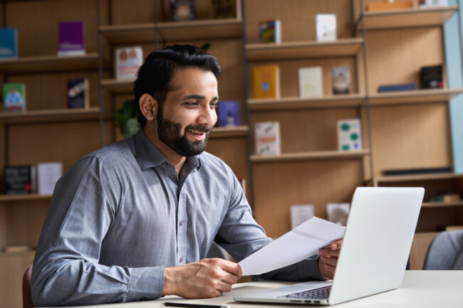 Professional reviewing compliance guidelines and changes.