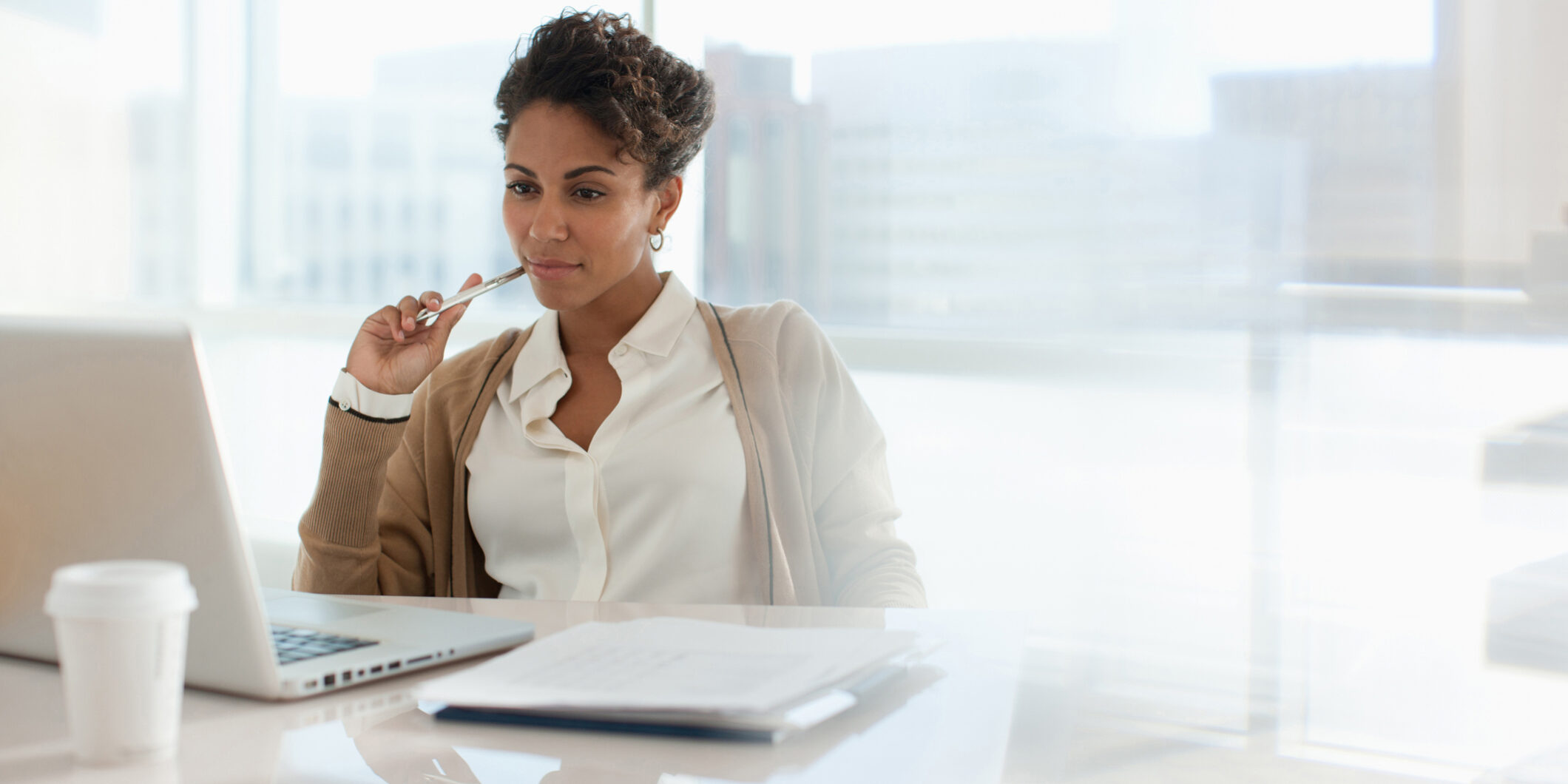 Woman filling out paperwork for compliance.