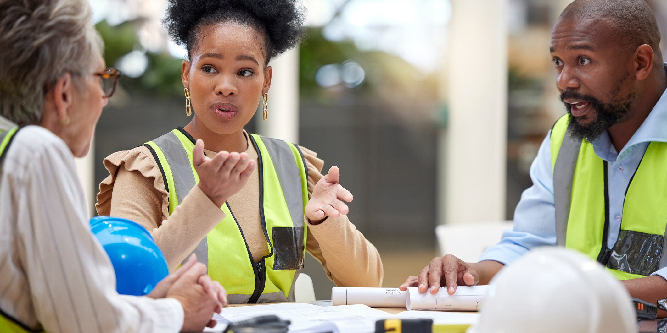 Office meeting, planning and engineering people in teamwork, collaboration and ideas for blueprint design. Project management, floor plan questions and manager, woman or group talking of architecture