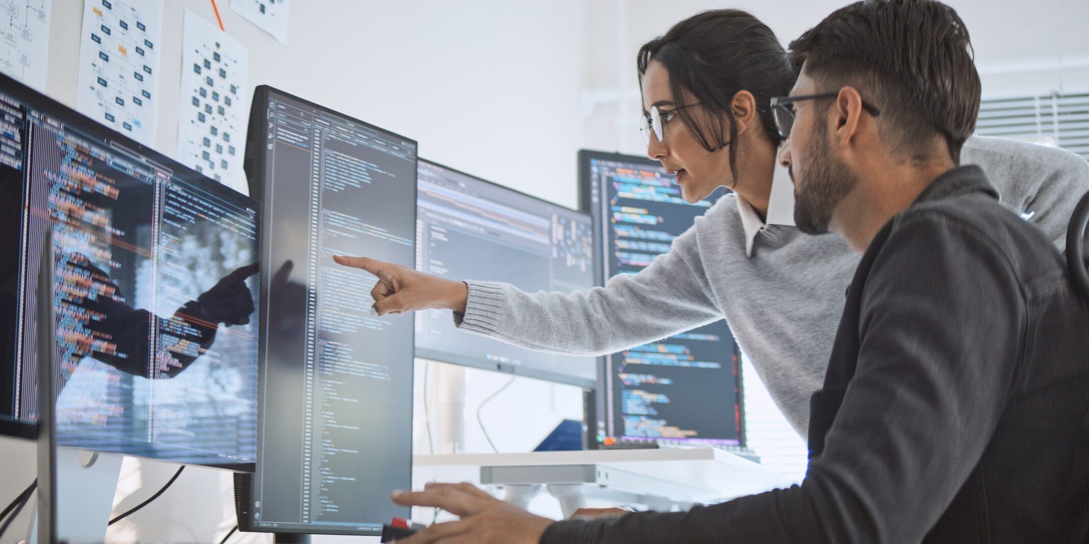 Hispanic Latin American couple, software engineer developer use computer, work on program coding together at home office. Programming language development technology, freelance job concept Hispanic Latin American couple, software engineer developer use computer, work on program coding together at home office. Programming language development technology, freelance job concept
